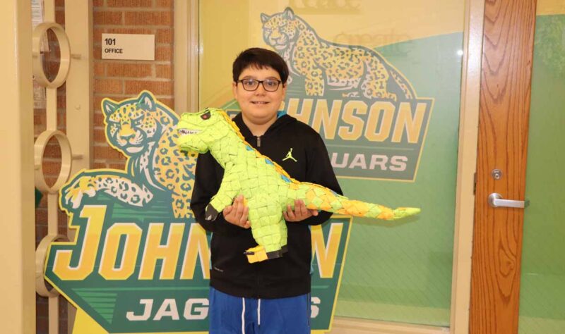 Fernando in 3rd grade with his Post It note STEM challenge creation!